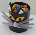 black cat candy tin